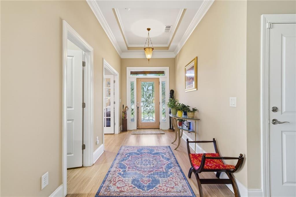 608 Red Leaf Way Canton, GA 30114 - Photo 10 of 43 a view of a hallway to a livingroom with furniture and windows