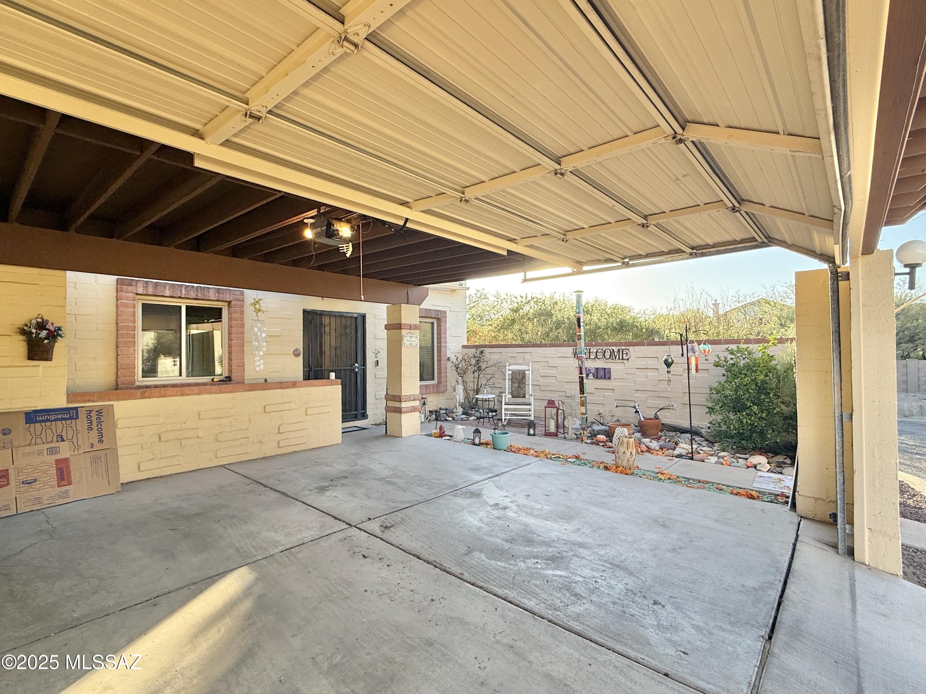 8110 East Rivenoak Circle Tucson, AZ 85715 - Photo 2 of 29 a view of a terrace with chairs and tables