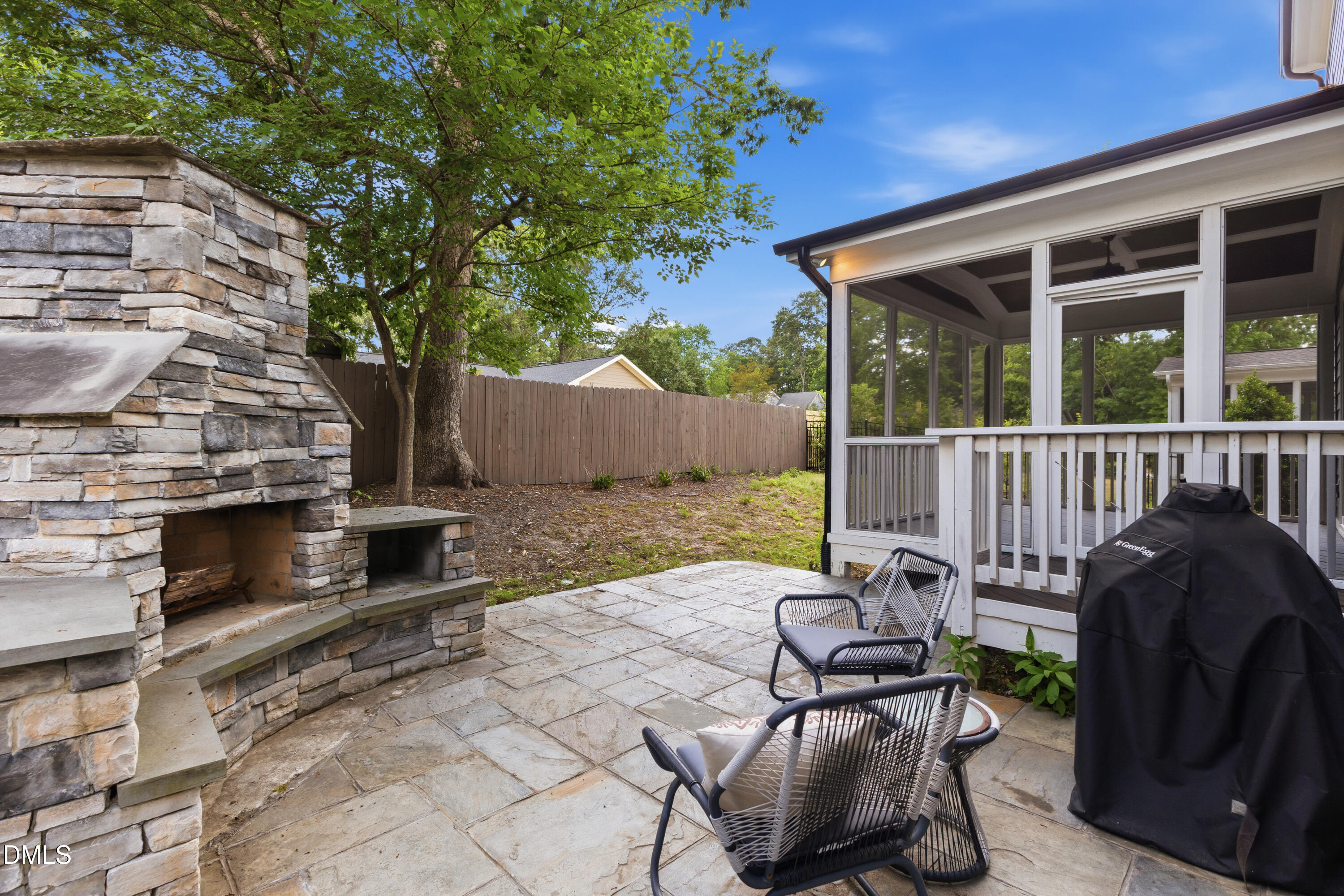 7421 Stonehenge Farm Lane Raleigh, NC 27613 - Photo 32 of 48 a view of a patio with chair and tables back yard of the house