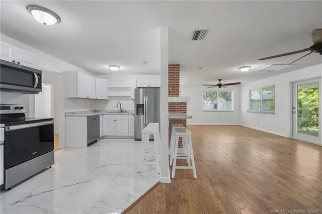 a view of cabinets and window