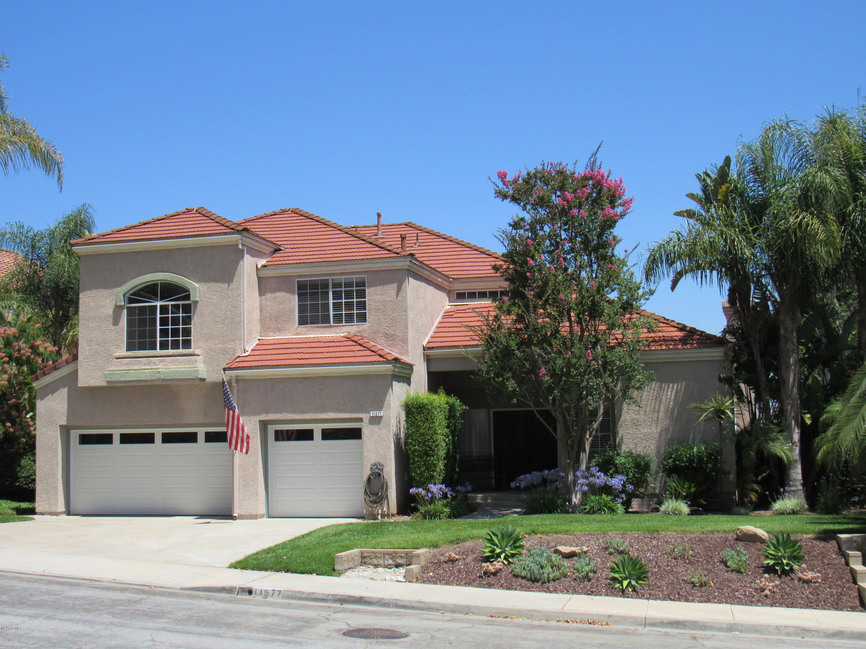 11577 Chestnut Ridge Street Moorpark, CA 93021 - Photo 1 of 58 a front view of a house with a yard and garage