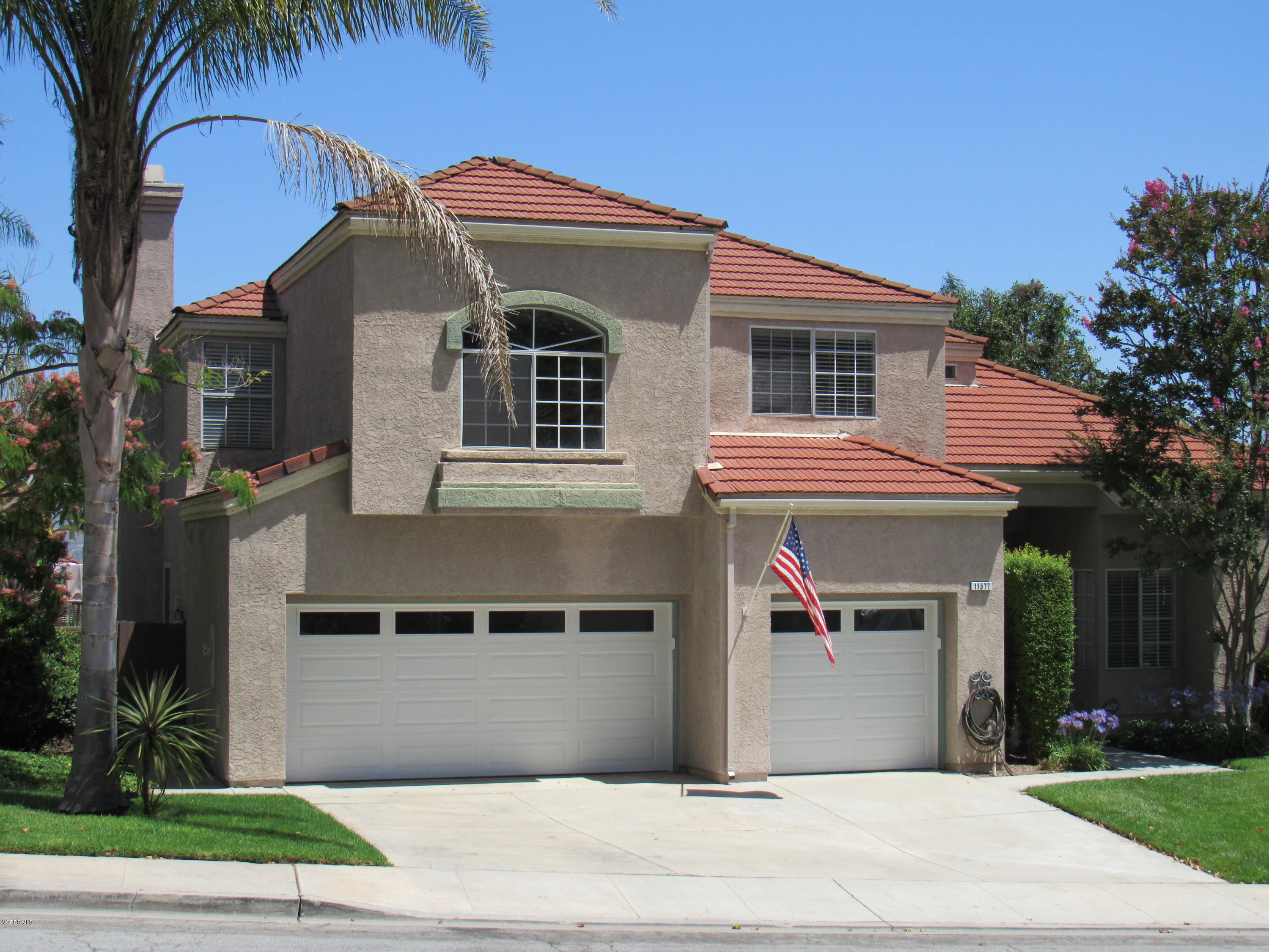 11577 Chestnut Ridge Street Moorpark, CA 93021 - Photo 2 of 58 a front view of house with garage and yard