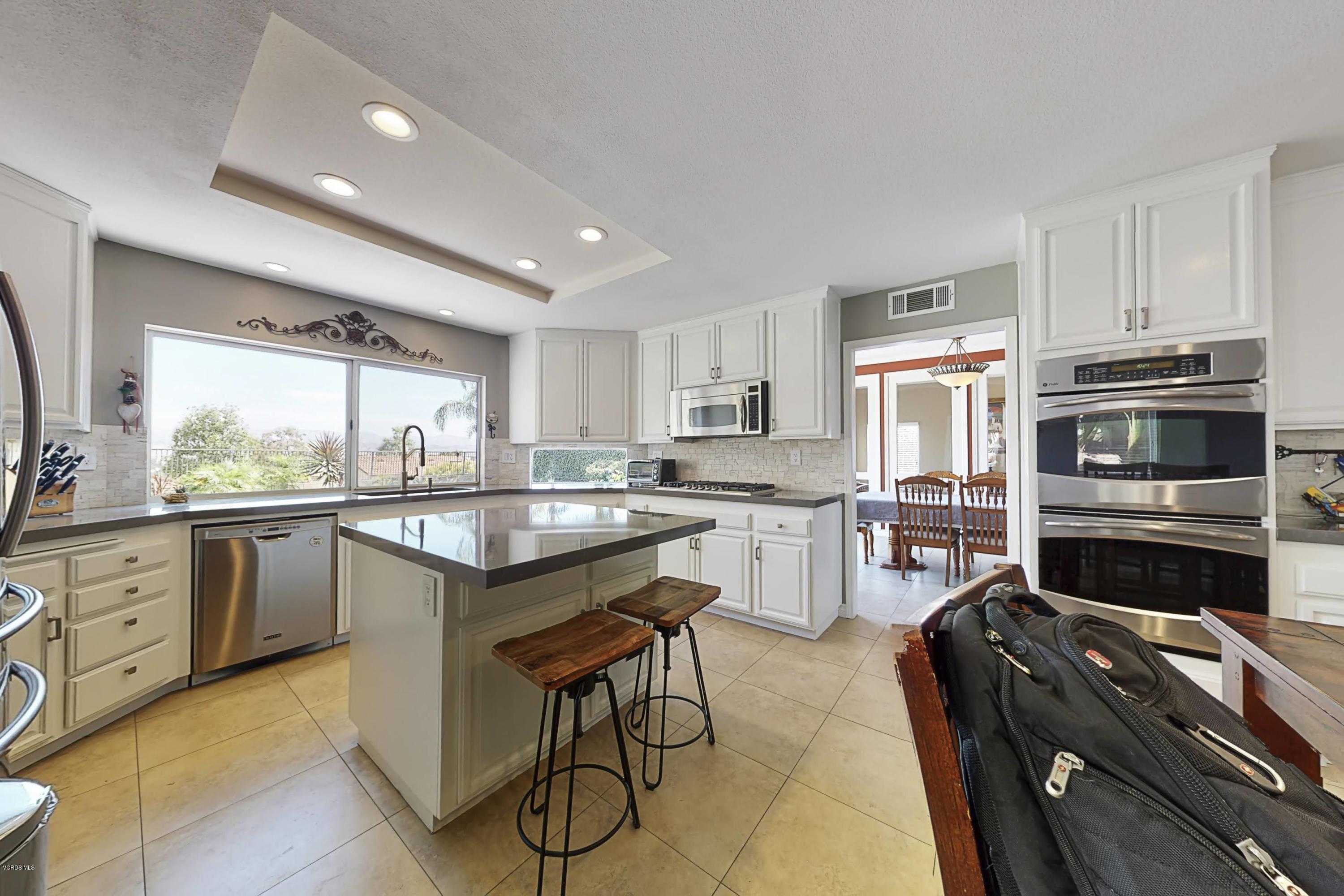 11577 Chestnut Ridge Street Moorpark, CA 93021 - Photo 11 of 58 a kitchen with a sink stainless steel appliances and window
