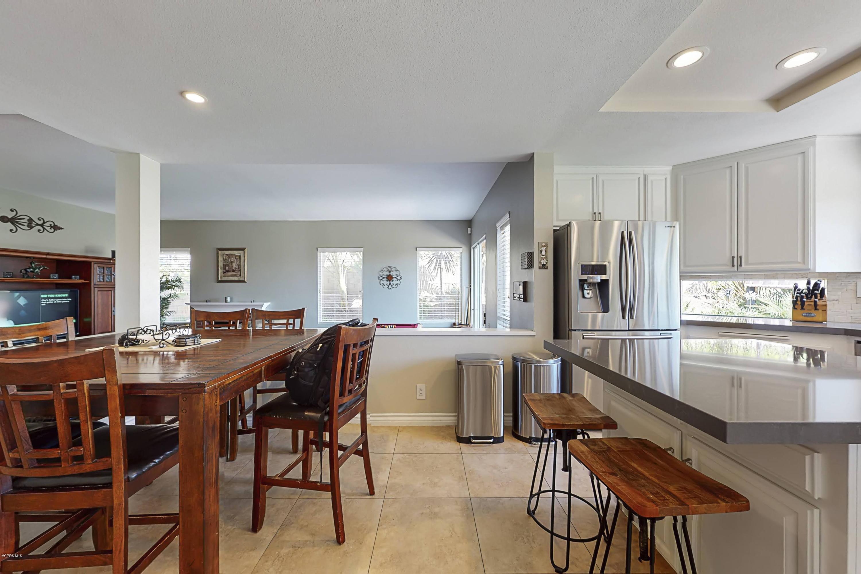 11577 Chestnut Ridge Street Moorpark, CA 93021 - Photo 17 of 58 a view of a dining room with furniture