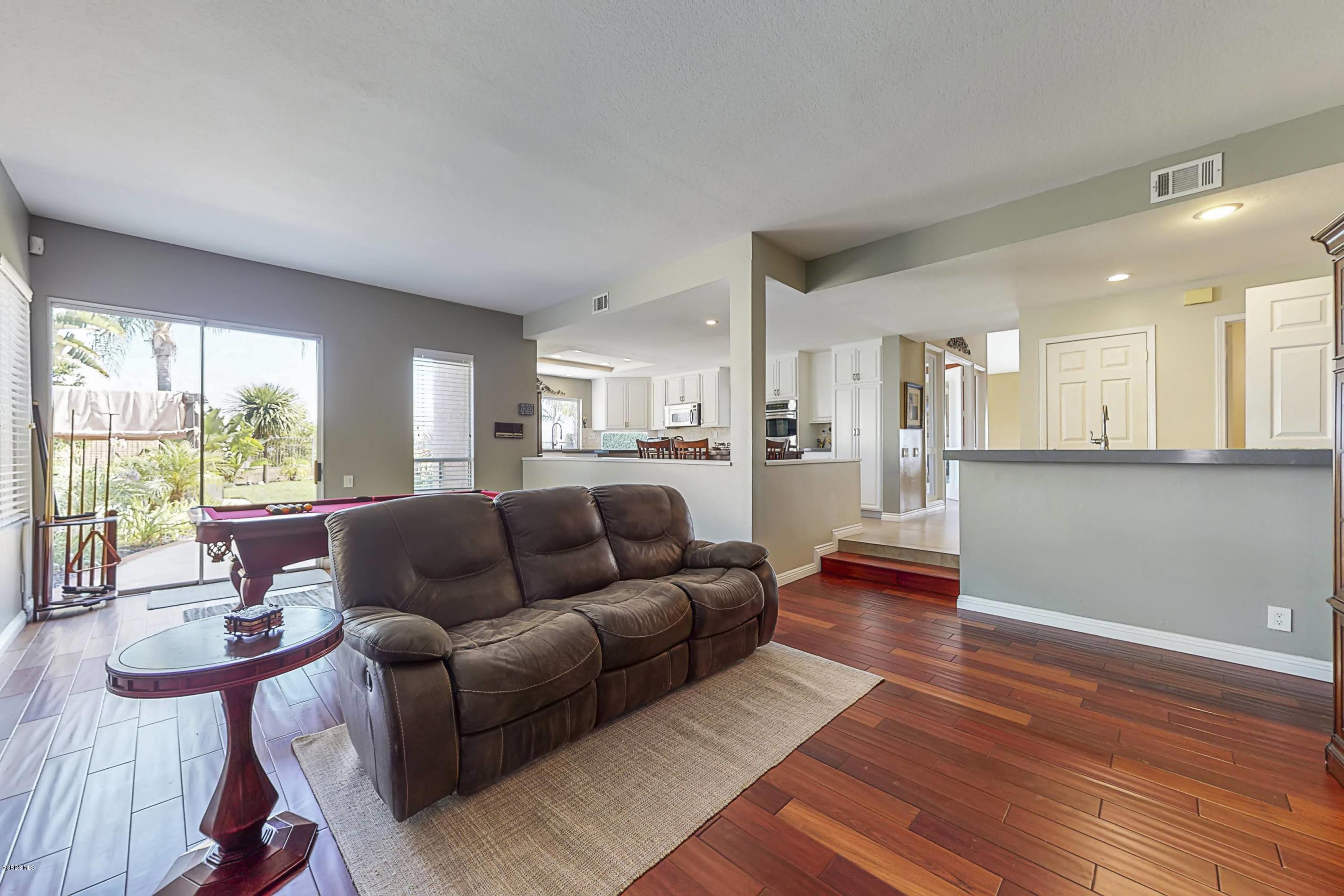 11577 Chestnut Ridge Street Moorpark, CA 93021 - Photo 21 of 58 a living room with furniture and a large window