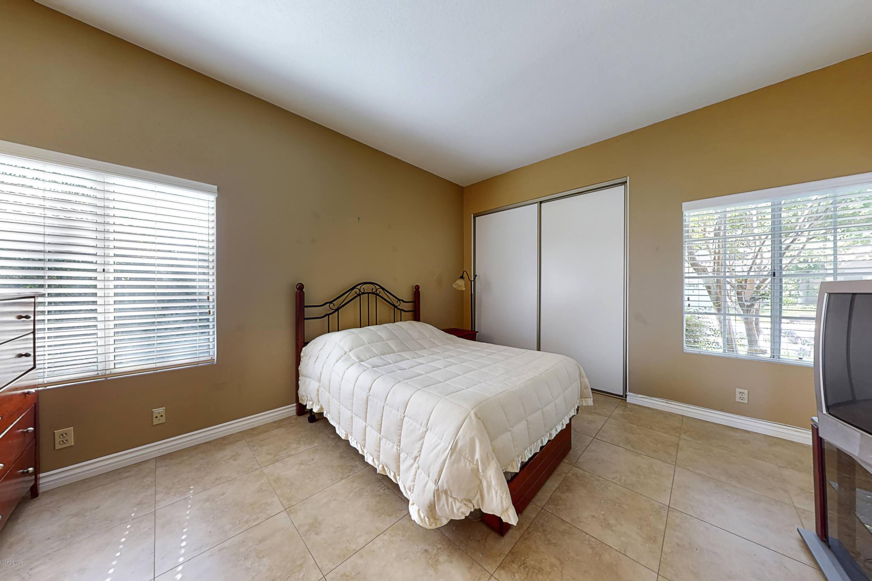 11577 Chestnut Ridge Street Moorpark, CA 93021 - Photo 25 of 58 a bedroom with a bed and a window