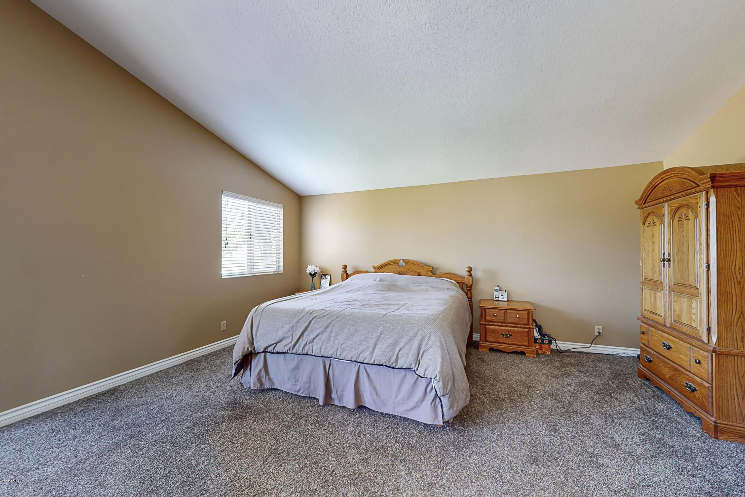 11577 Chestnut Ridge Street Moorpark, CA 93021 - Photo 29 of 58 a bedroom with a bed and a window