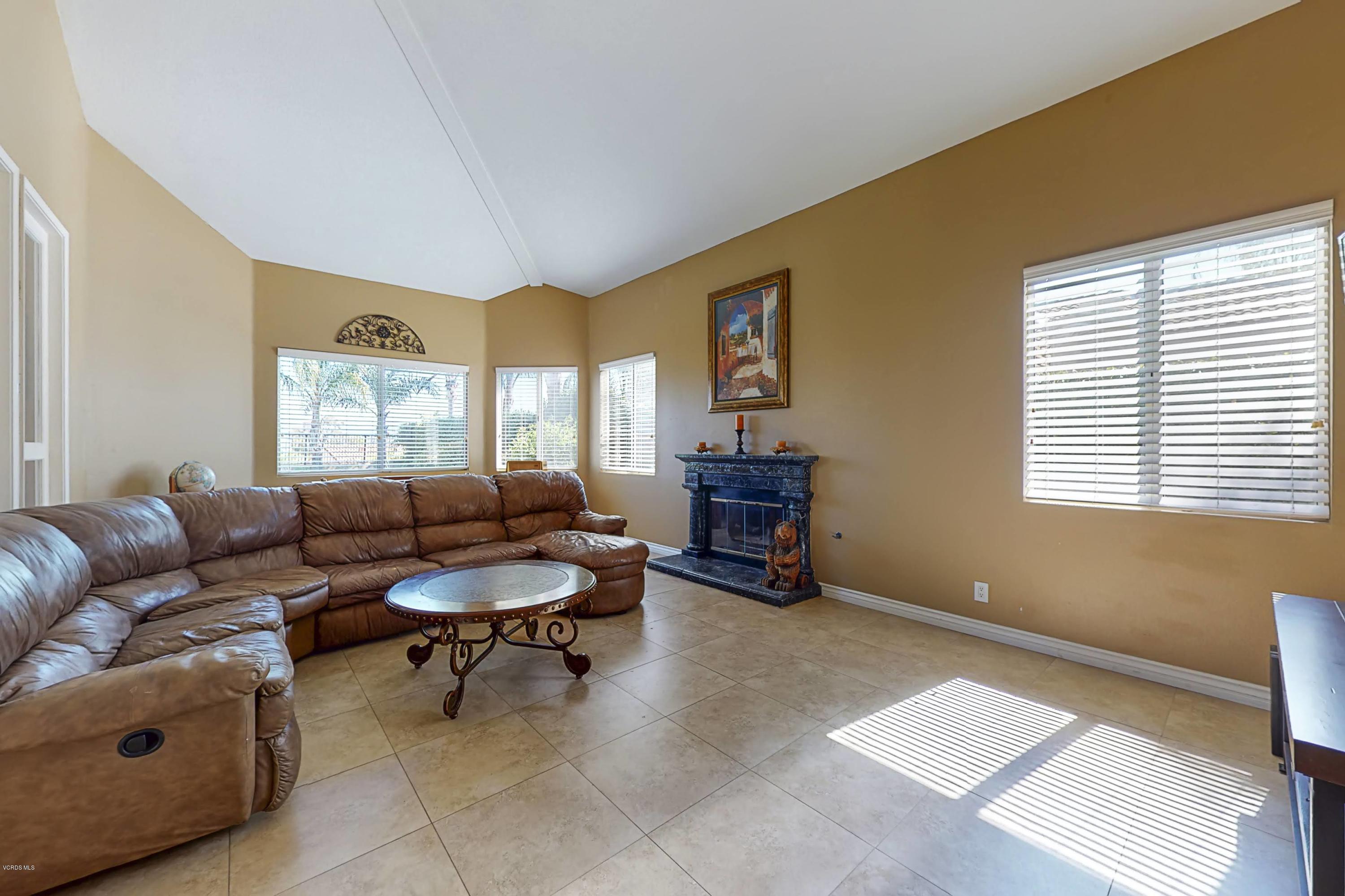 11577 Chestnut Ridge Street Moorpark, CA 93021 - Photo 4 of 58 a living room with furniture and a large window