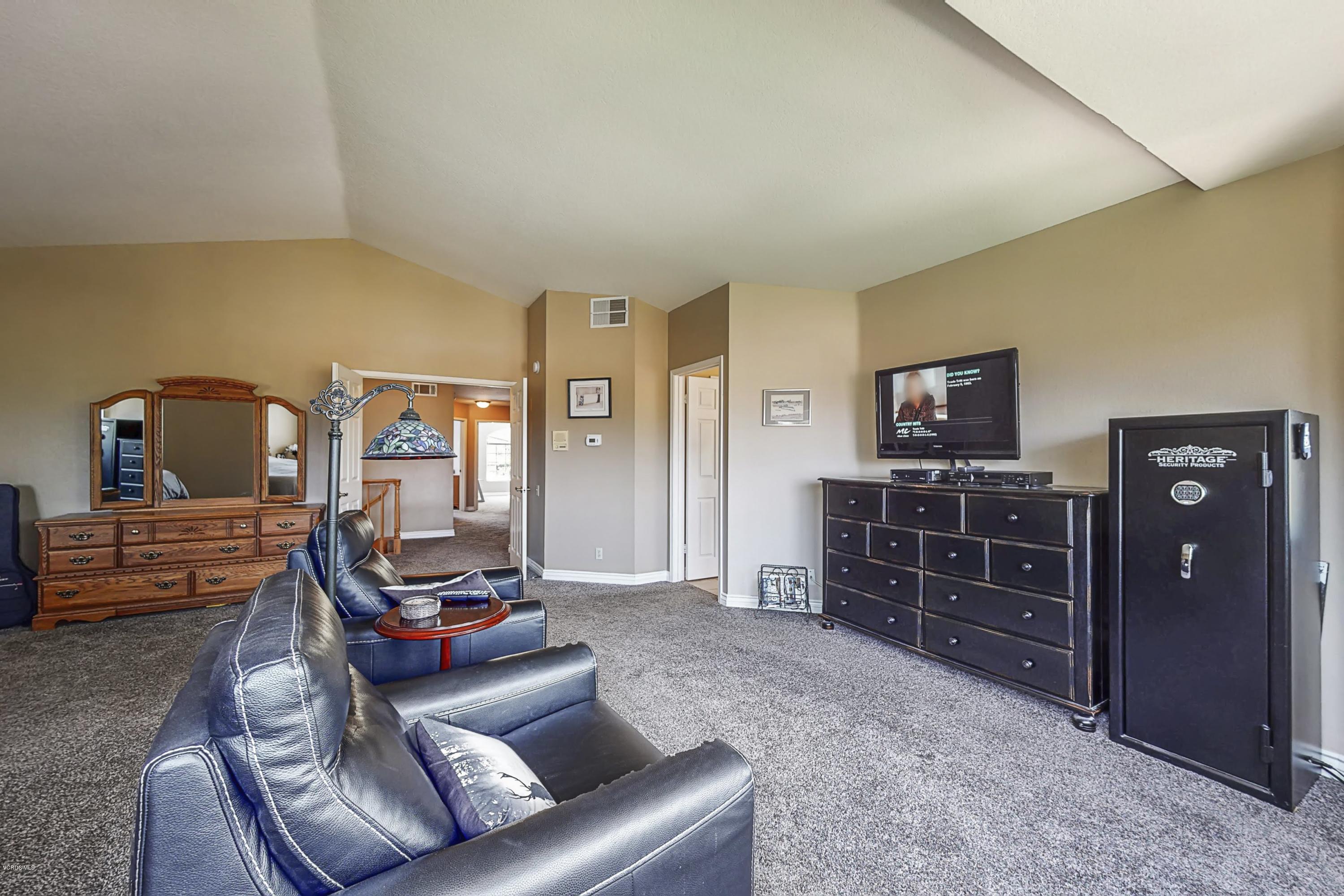 11577 Chestnut Ridge Street Moorpark, CA 93021 - Photo 32 of 58 a living room with furniture and wooden floor