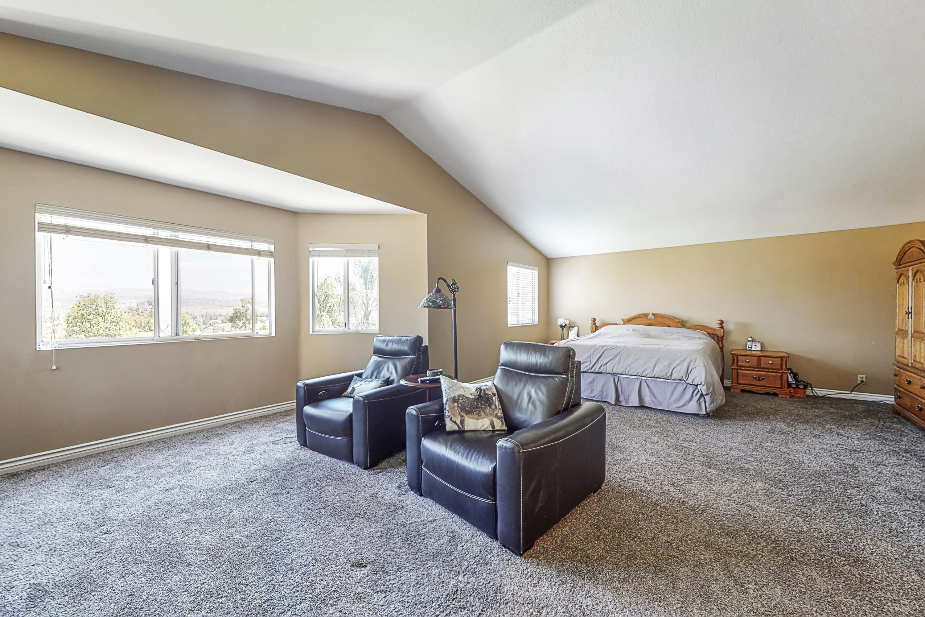 11577 Chestnut Ridge Street Moorpark, CA 93021 - Photo 33 of 58 a bedroom with furniture and a window