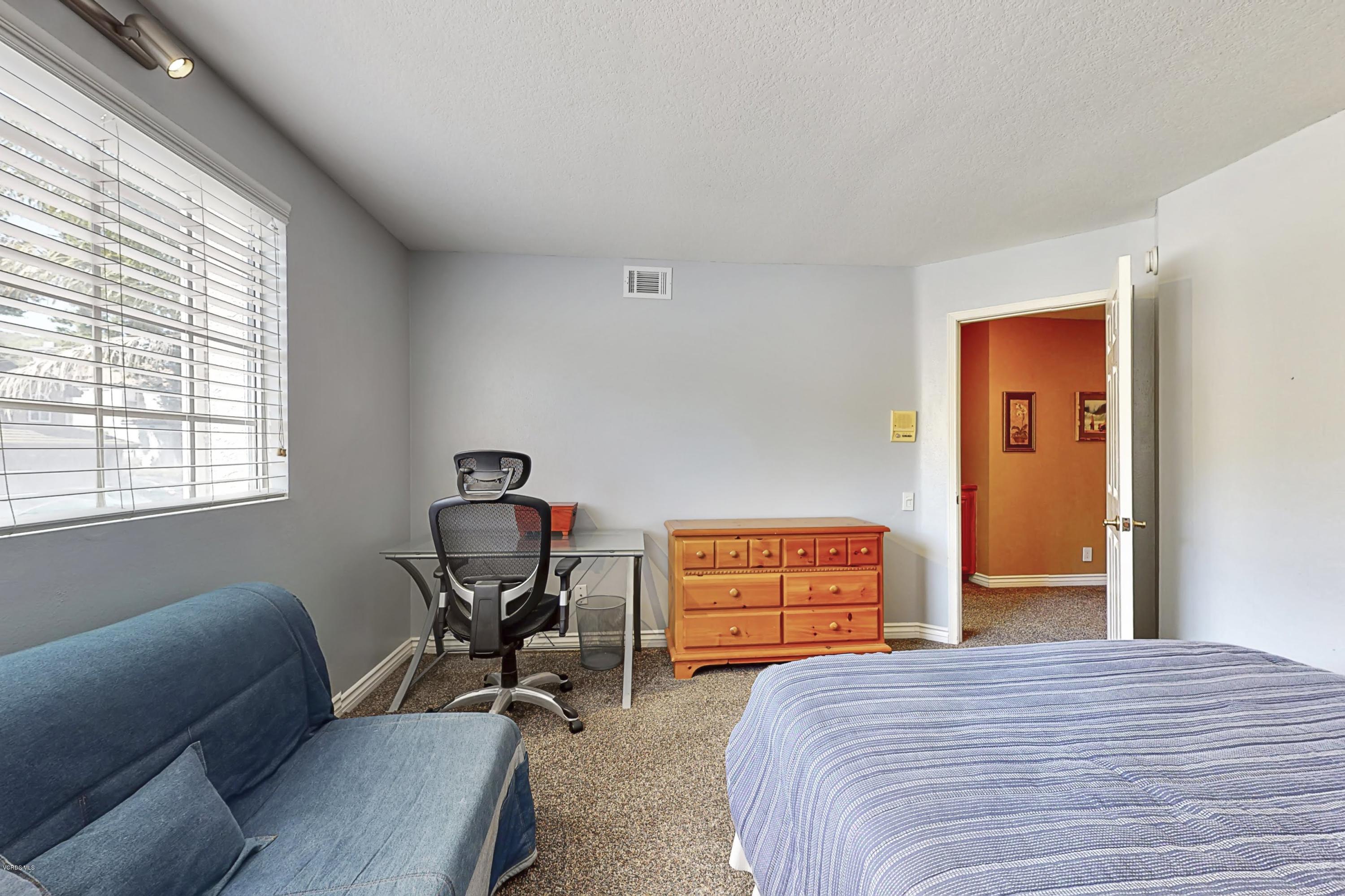 11577 Chestnut Ridge Street Moorpark, CA 93021 - Photo 34 of 58 a bedroom with a bed and a window