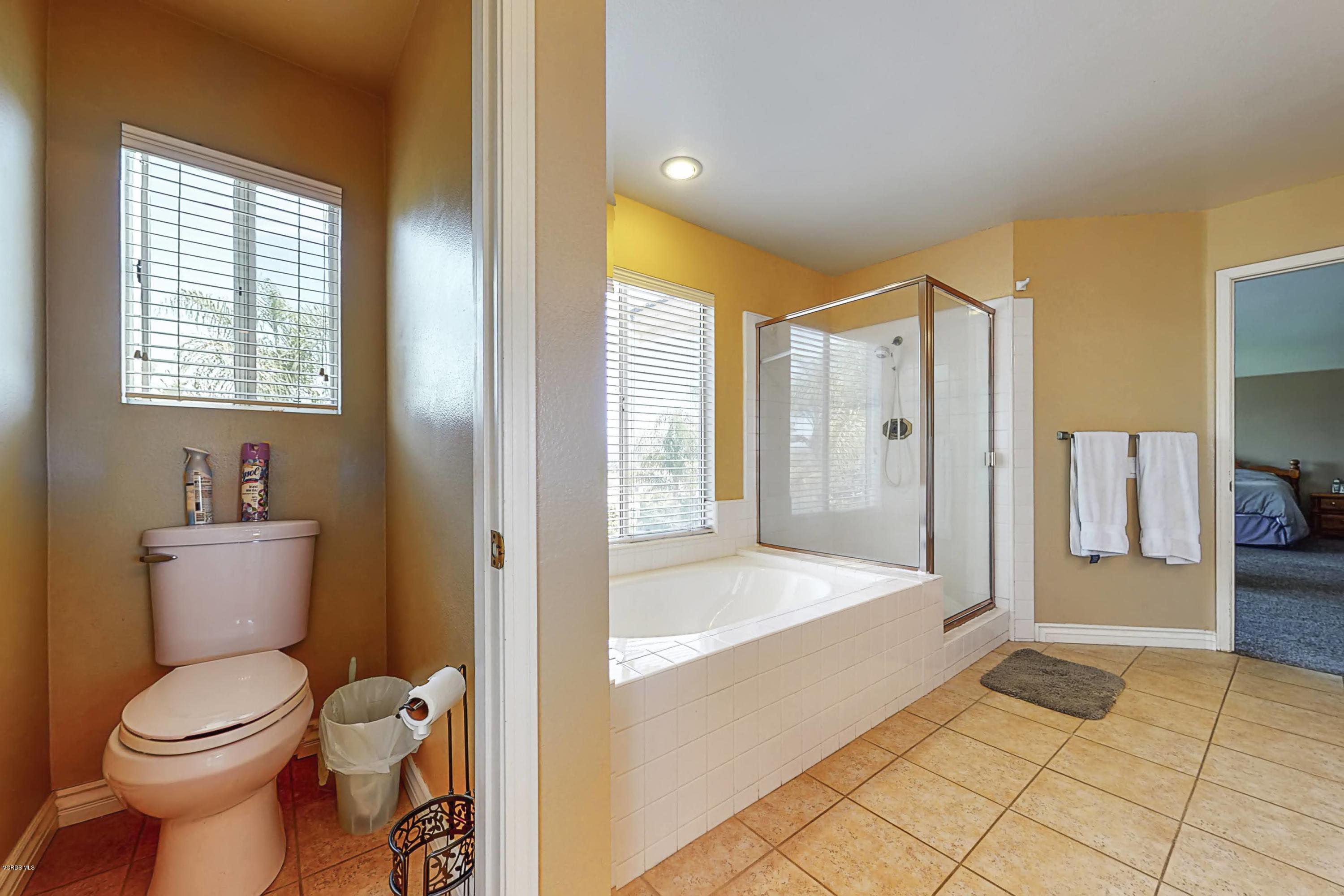 11577 Chestnut Ridge Street Moorpark, CA 93021 - Photo 36 of 58 a bathroom with a toilet sink and shower