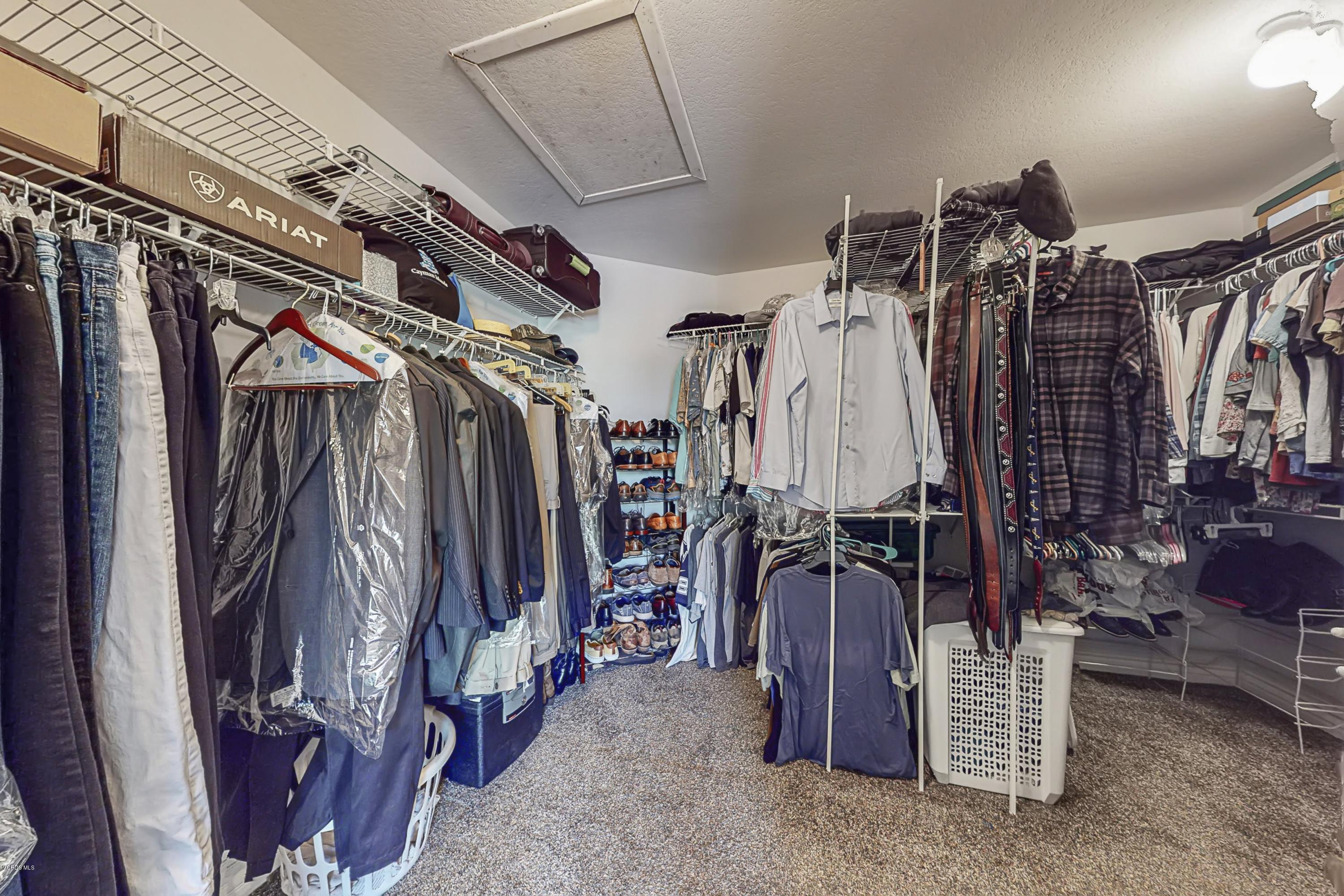 11577 Chestnut Ridge Street Moorpark, CA 93021 - Photo 39 of 58 a view of walk in closet with clothes and shoes