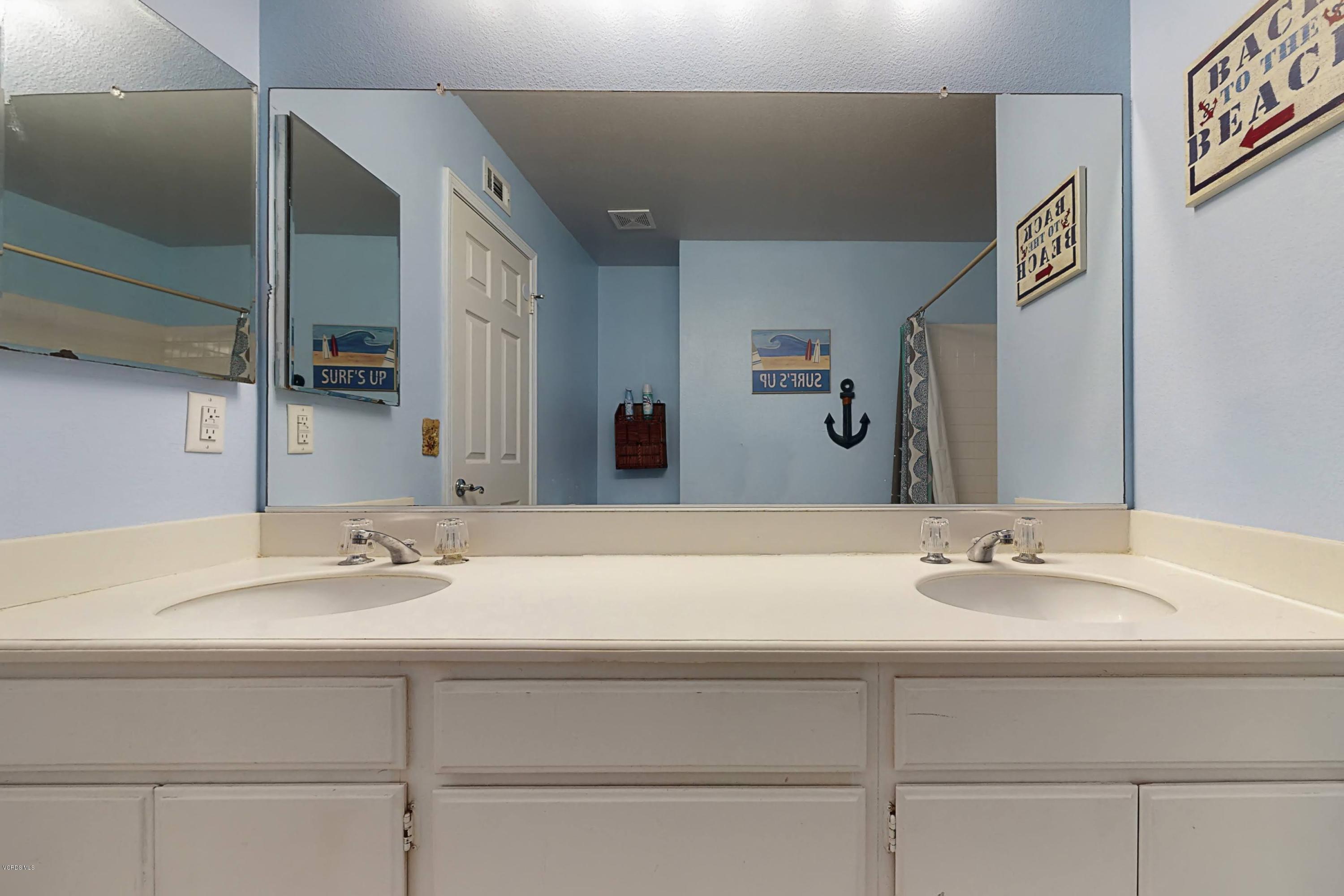 11577 Chestnut Ridge Street Moorpark, CA 93021 - Photo 41 of 58 a bathroom with a sink and a mirror