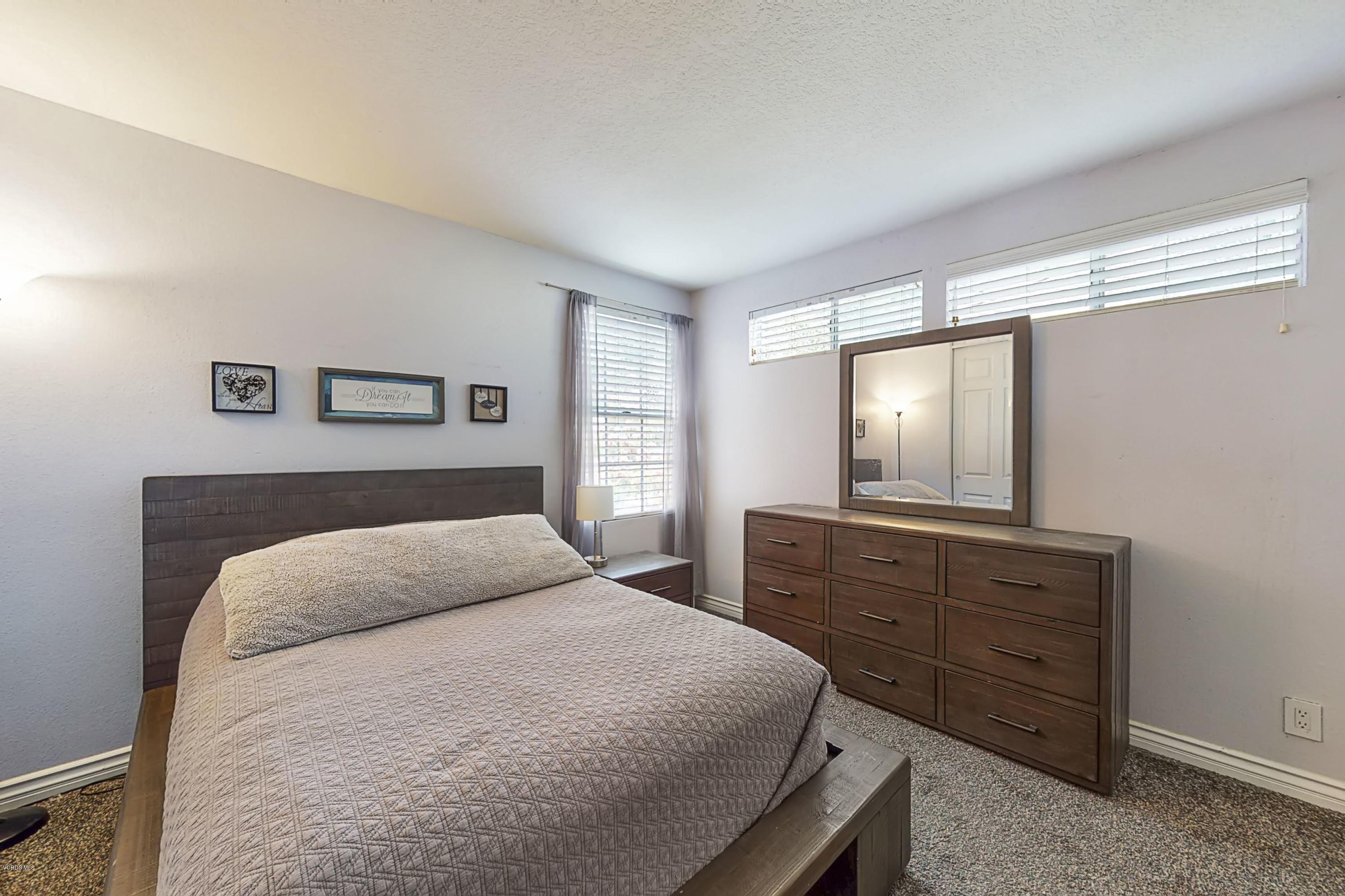 11577 Chestnut Ridge Street Moorpark, CA 93021 - Photo 43 of 58 a bedroom with a bed and a dresser