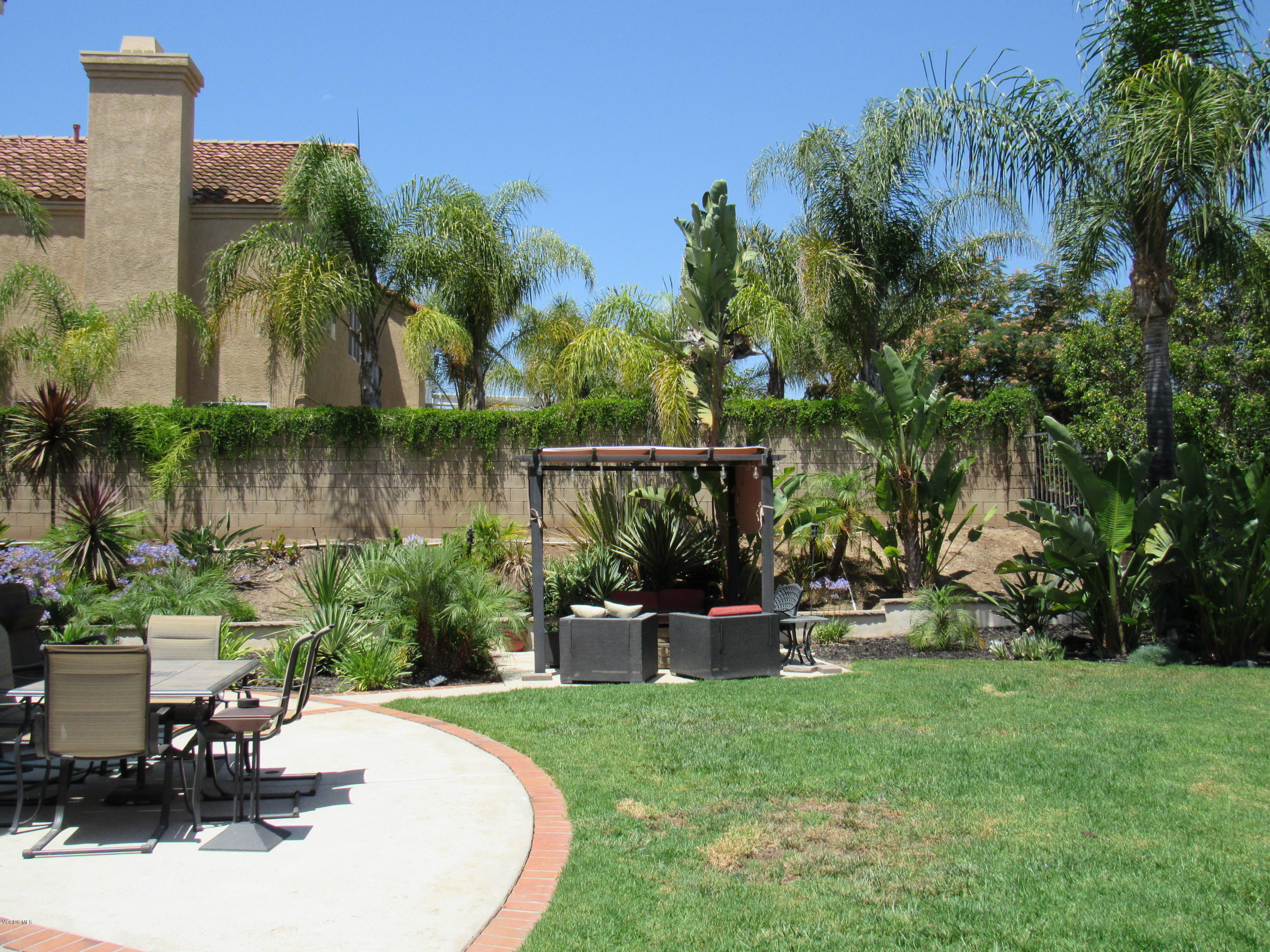 11577 Chestnut Ridge Street Moorpark, CA 93021 - Photo 50 of 58 a view of a backyard with plants and outdoor seating