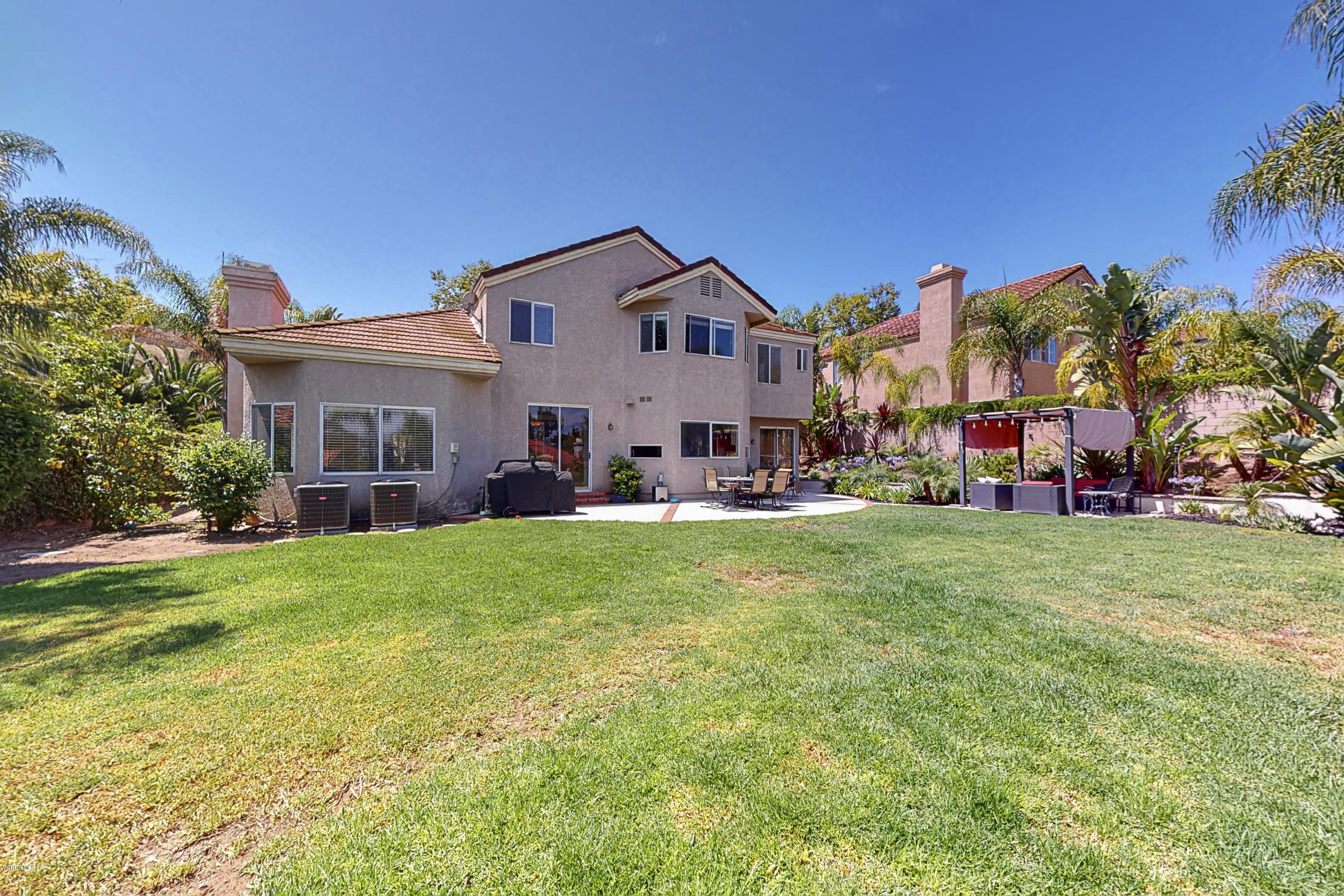 11577 Chestnut Ridge Street Moorpark, CA 93021 - Photo 53 of 58 a front view of house with yard and green space
