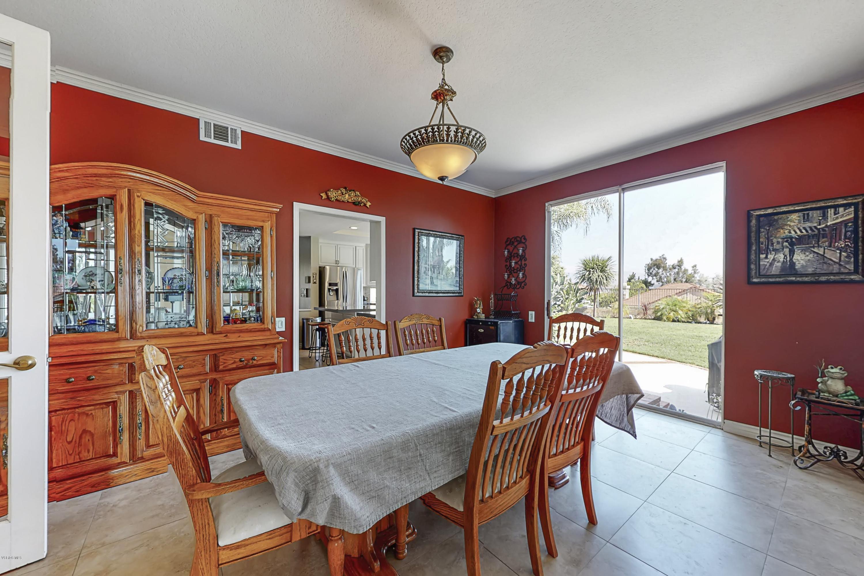 11577 Chestnut Ridge Street Moorpark, CA 93021 - Photo 10 of 58 a view of a dining room with furniture window and outside view