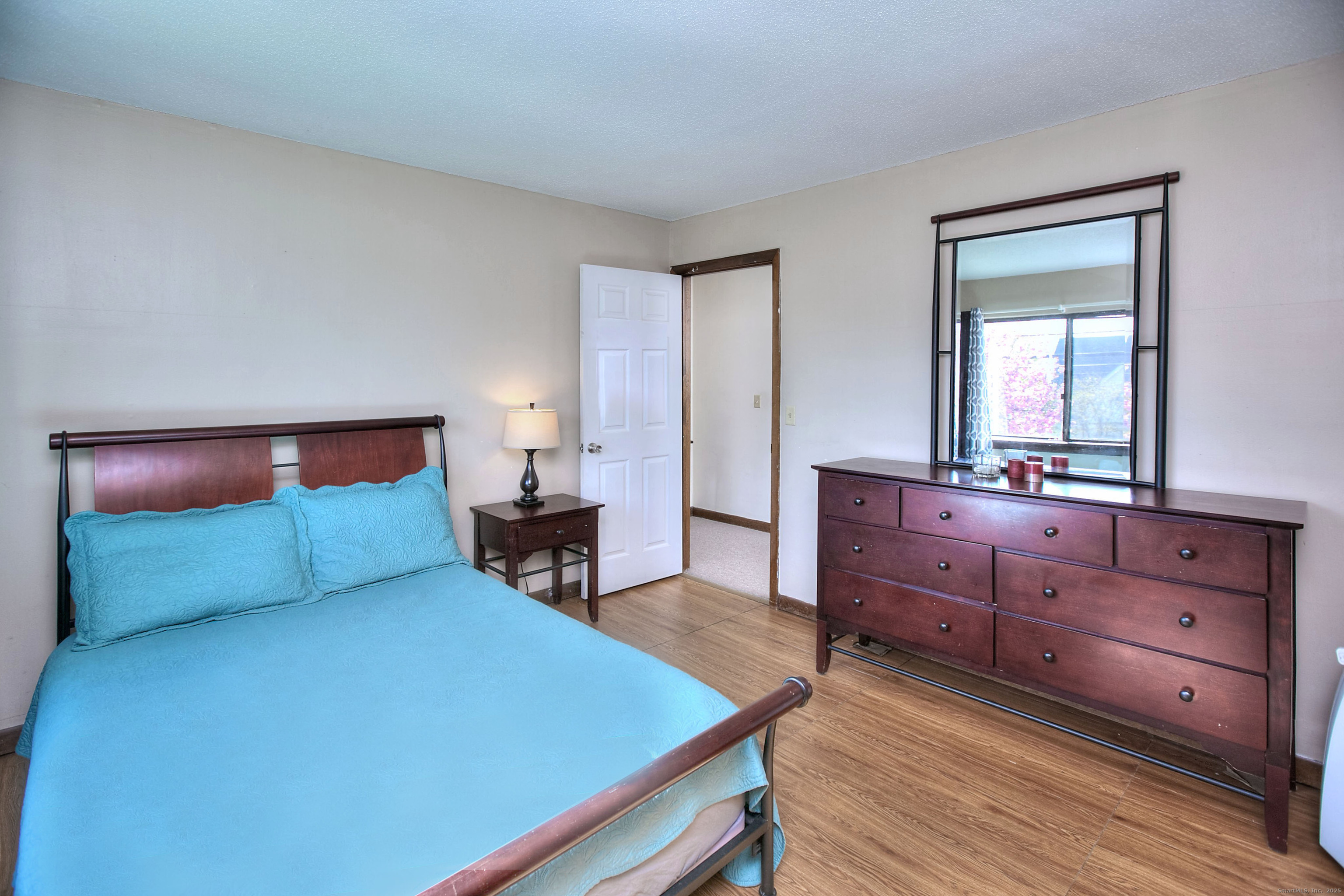 223 River Road Shelton, CT 06484 - Photo 7 of 11 a bedroom with a bed and a dresser