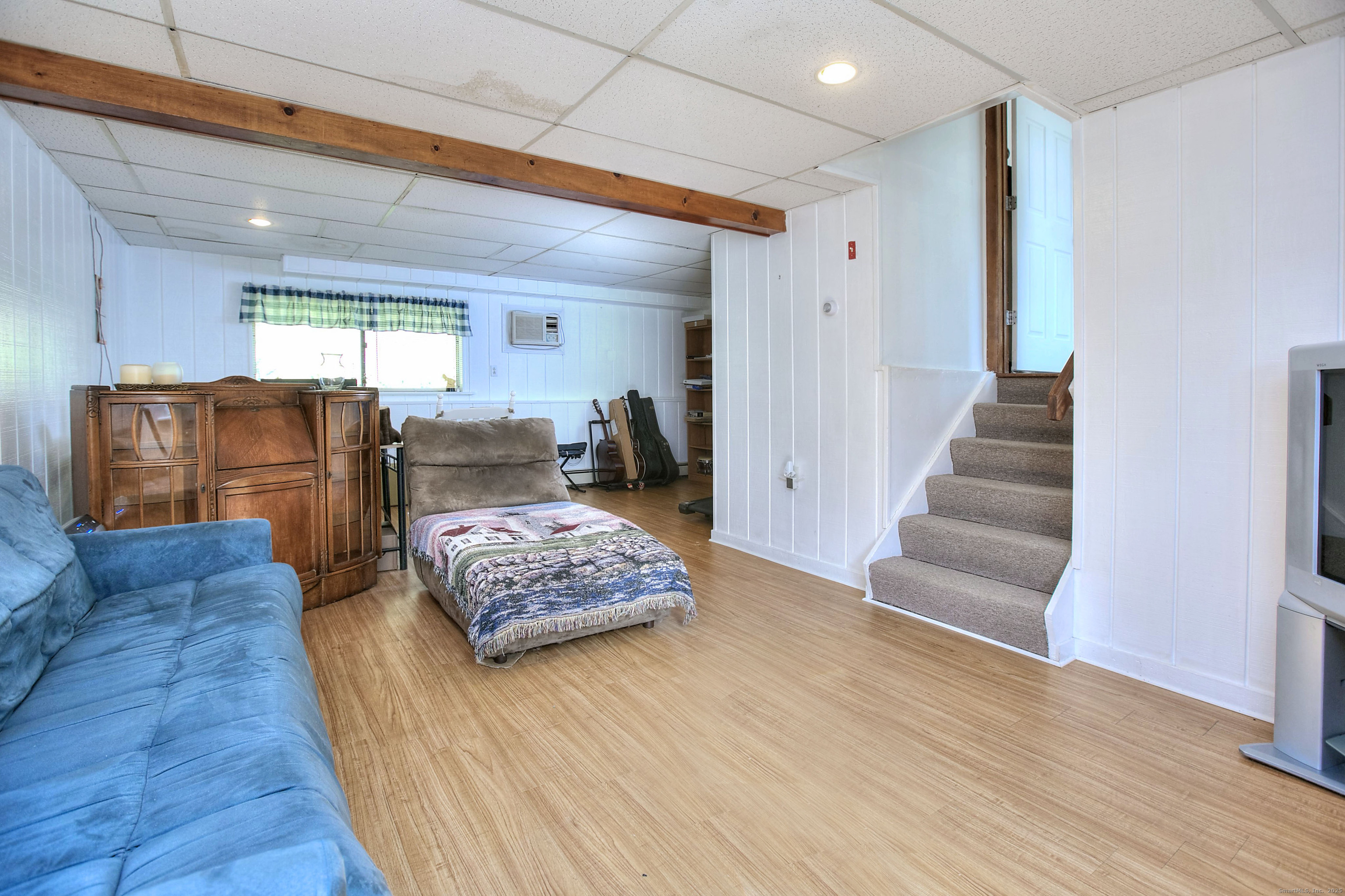 223 River Road Shelton, CT 06484 - Photo 9 of 11 a living room with furniture and a wooden floor