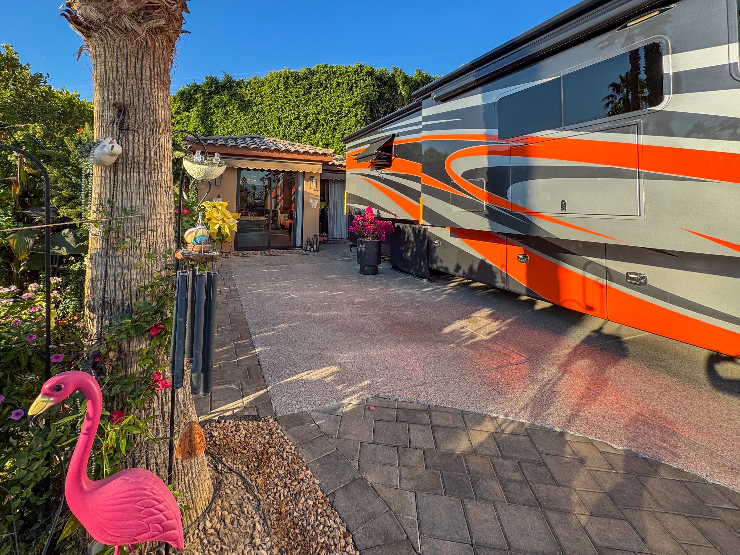 a backyard of a house with barbeque oven table and chairs