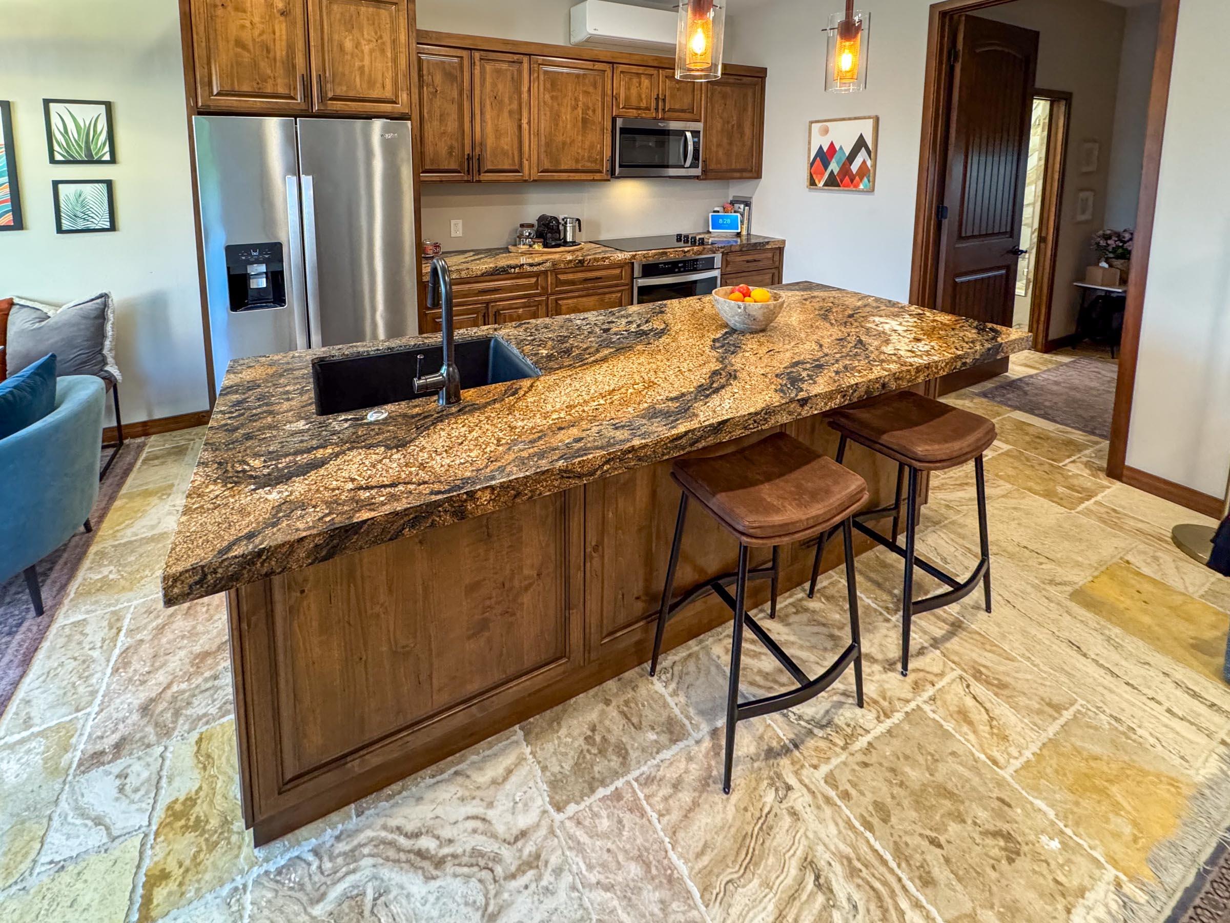 80394 Ave 48, Unit 156 Indio, CA 92201 - Photo 16 of 42 a kitchen with stainless steel appliances granite countertop a refrigerator and a stove top oven