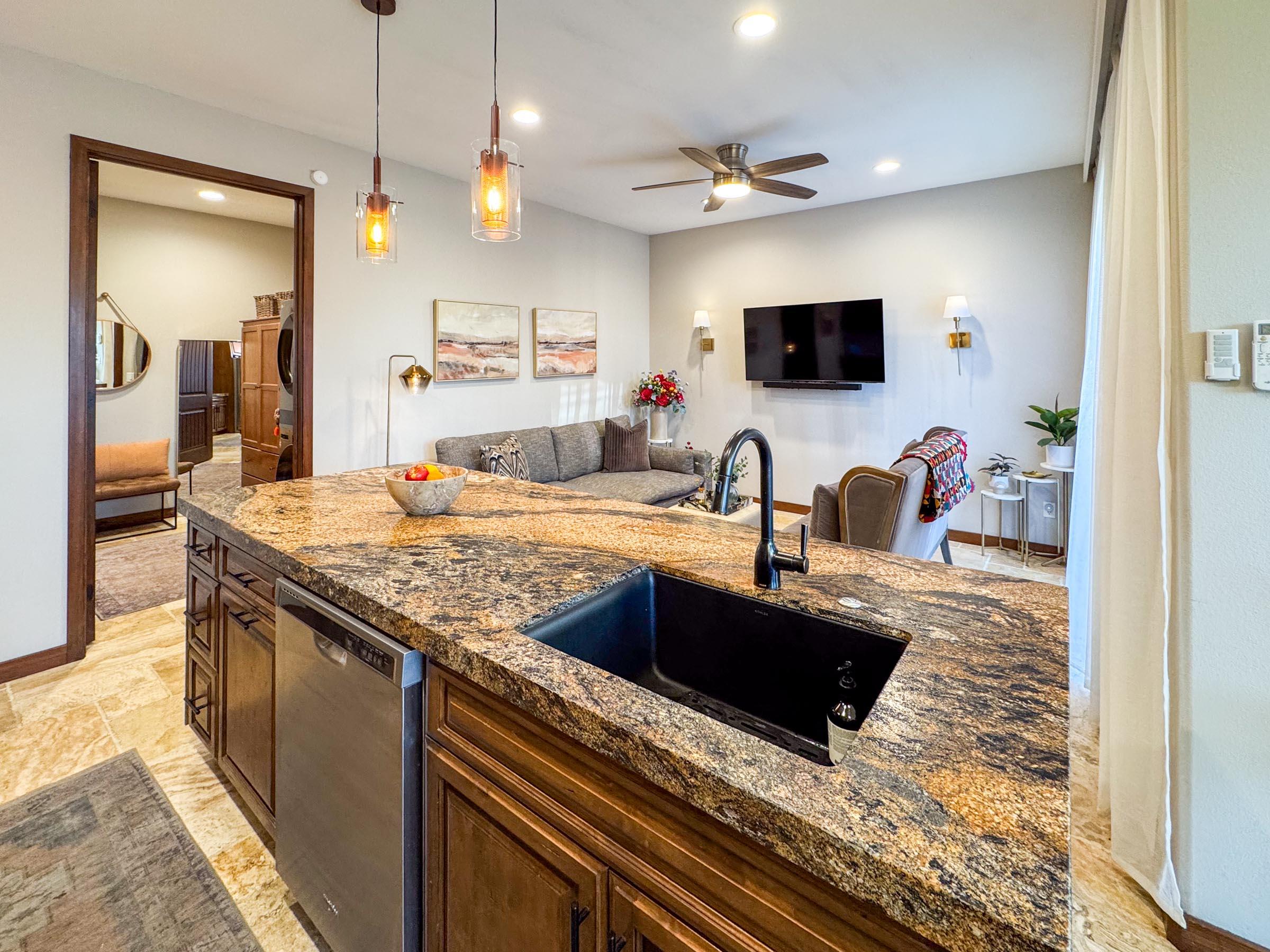 80394 Ave 48, Unit 156 Indio, CA 92201 - Photo 21 of 42 a kitchen with kitchen island granite countertop a sink and a stove