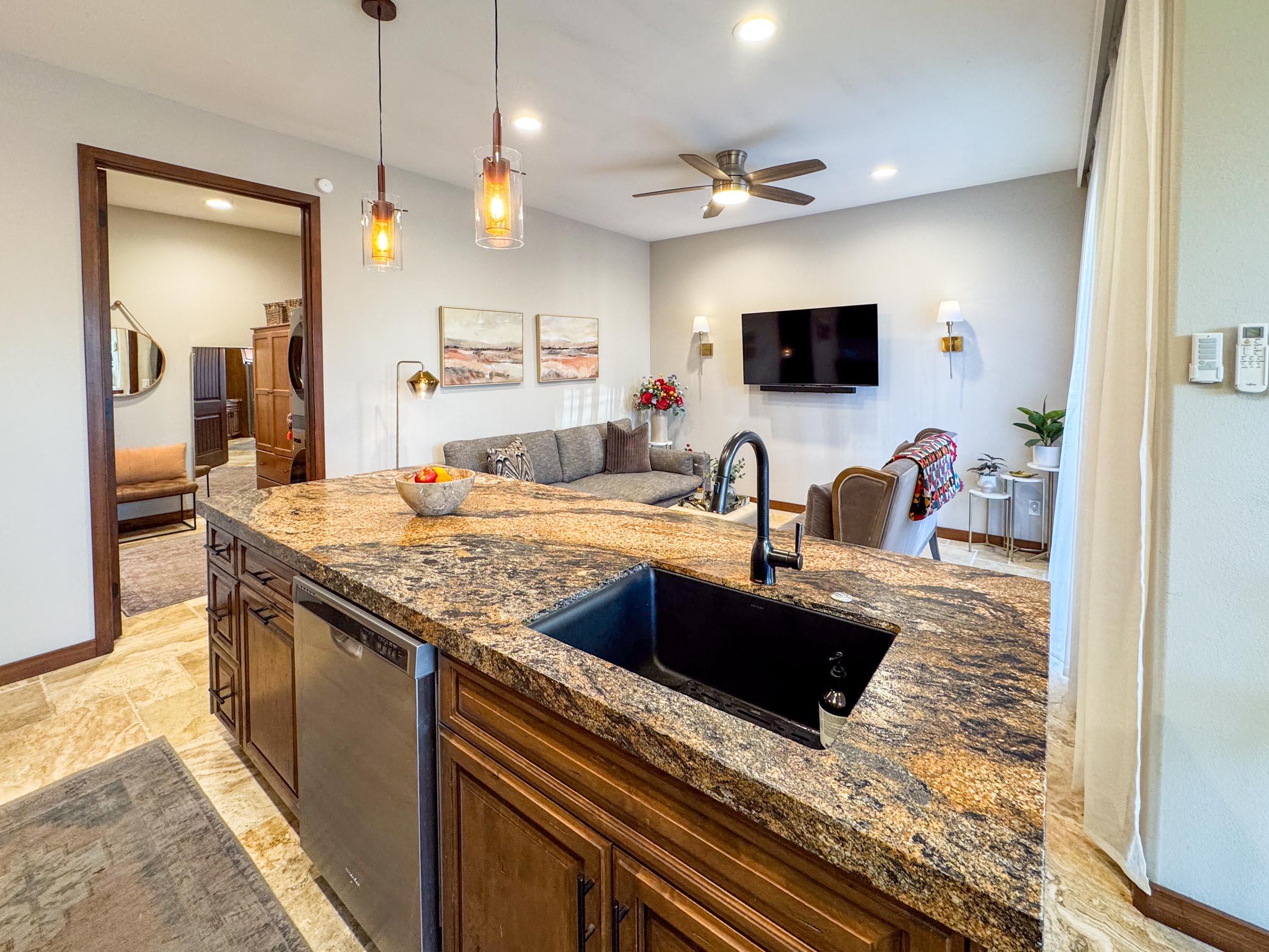 80394 Ave 48, Unit 156 Indio, CA 92201 - Photo 22 of 42 a kitchen with kitchen island granite countertop a sink and a stove