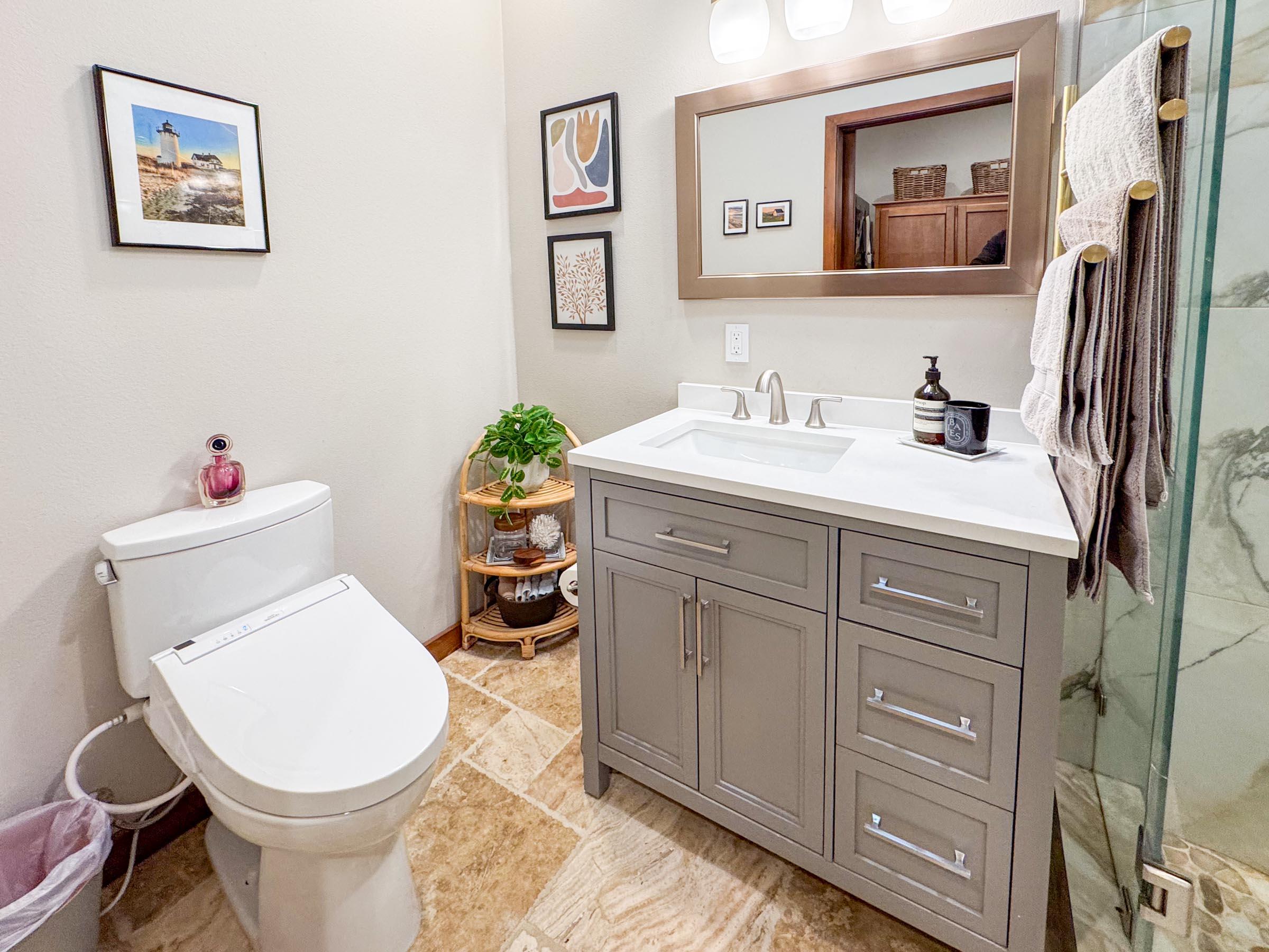 80394 Ave 48, Unit 156 Indio, CA 92201 - Photo 33 of 42 a bathroom with a toilet sink and mirror