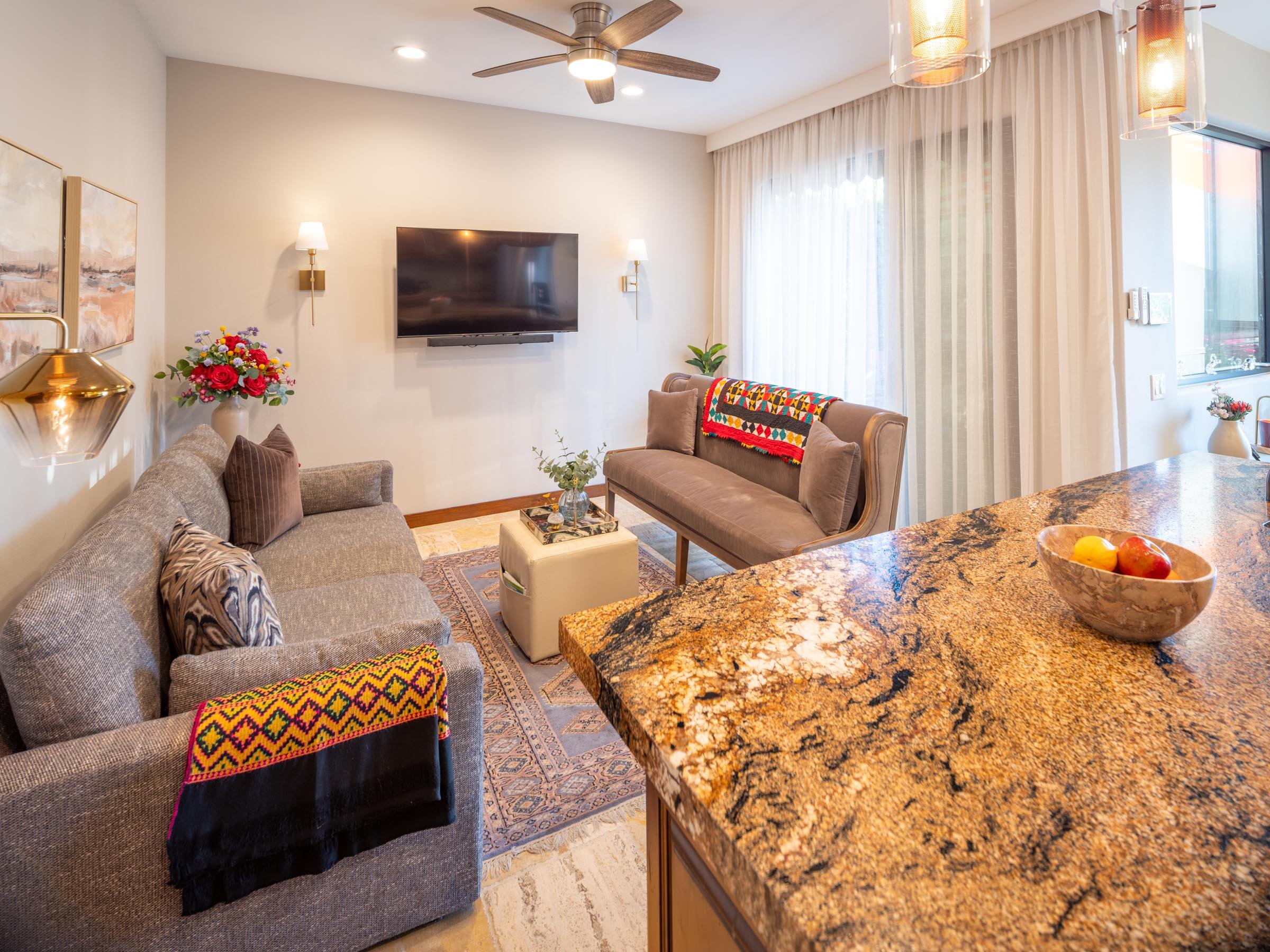 80394 Ave 48, Unit 156 Indio, CA 92201 - Photo 4 of 42 a living room with furniture and a flat screen tv