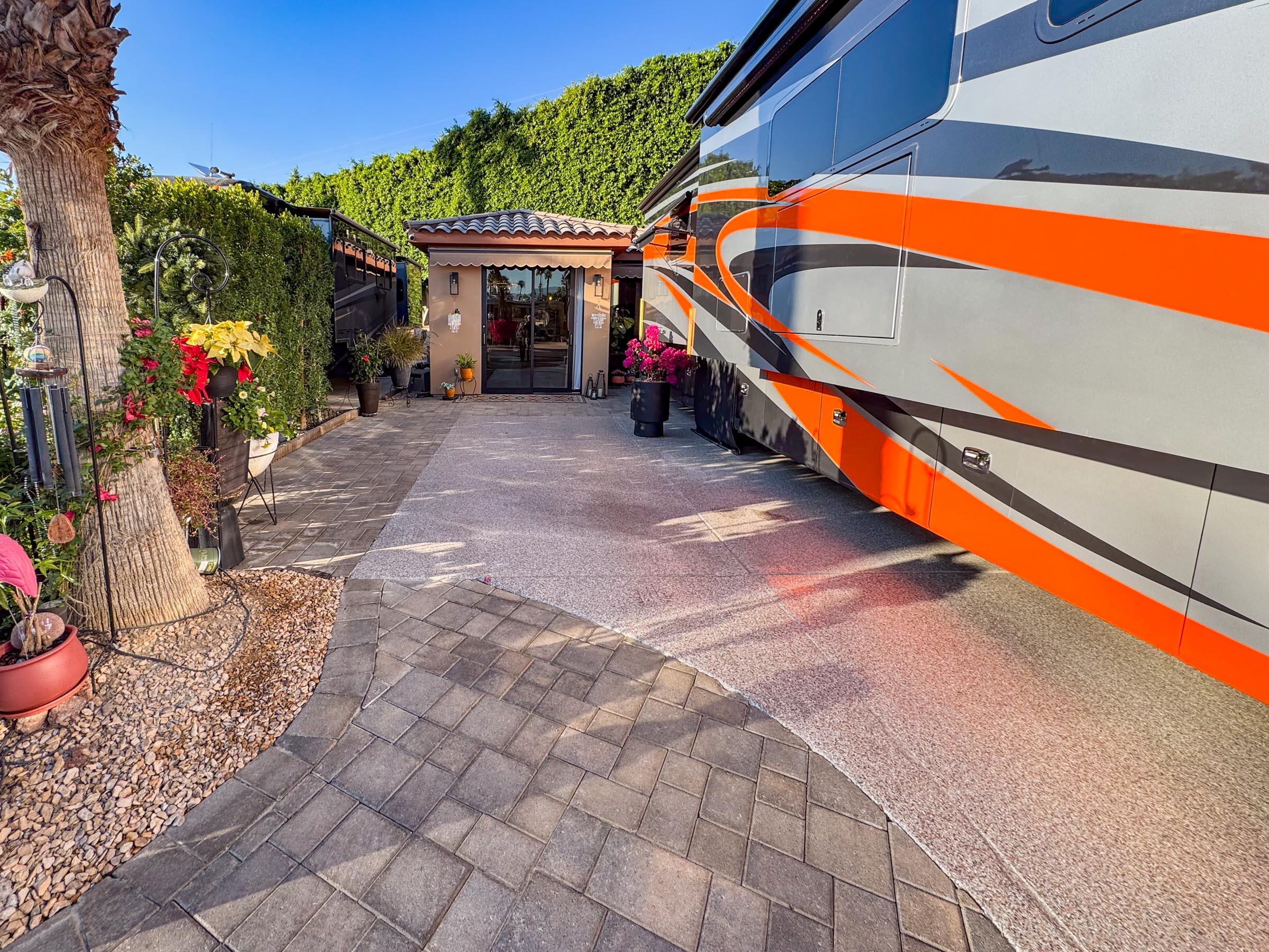 80394 Ave 48, Unit 156 Indio, CA 92201 - Photo 8 of 42 a backyard of a house with wooden floor and outdoor seating