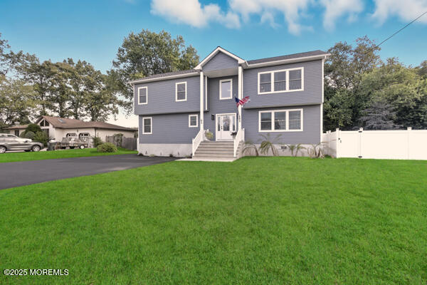 83 Whitesville Road Jackson, NJ 08527 - Photo 2 of 38 a front view of a house with a yard and trees