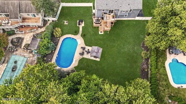 an aerial view of a house with a swimming pool