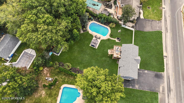 83 Whitesville Road Jackson, NJ 08527 - Photo 34 of 38 an aerial view of a house with a yard and garden