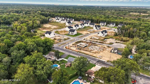 an aerial view of a city with ocean view