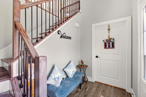83 Whitesville Road Jackson, NJ 08527 - Photo 4 of 38 a view of a hallway with wooden floor and stairs