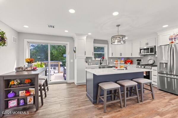 83 Whitesville Road Jackson, NJ 08527 - Photo 5 of 38 a kitchen with stainless steel appliances a dining table chairs stove and cabinets