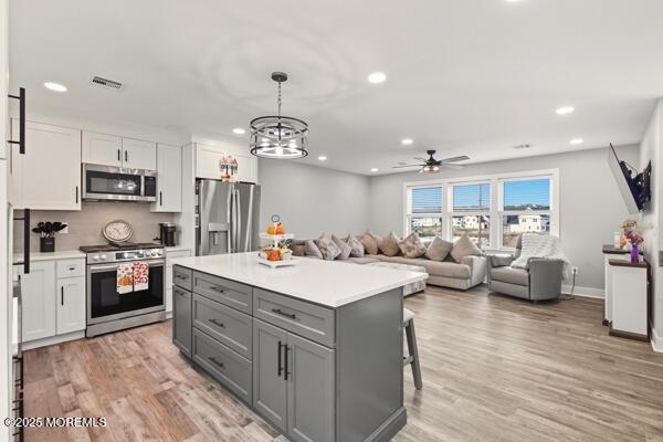 83 Whitesville Road Jackson, NJ 08527 - Photo 6 of 38 a large kitchen with kitchen island a sink a stove and a refrigerator