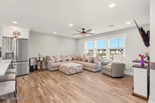 83 Whitesville Road Jackson, NJ 08527 - Photo 10 of 38 a living room with furniture or wooden floor and a chandelier