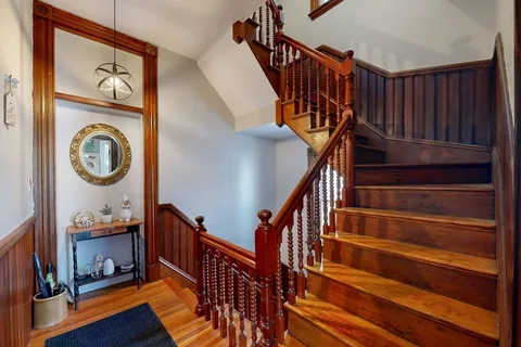 a view of entryway with wooden floor