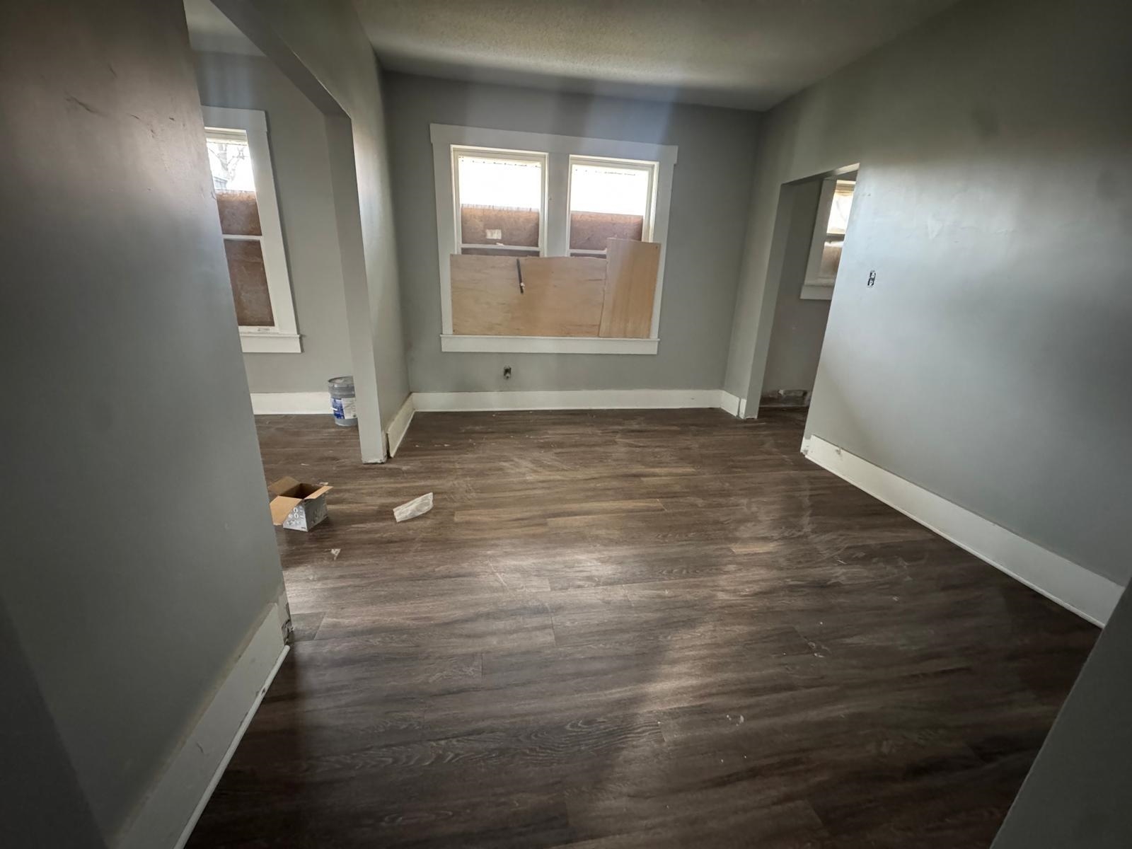 1134 Decatur Street Memphis, TN 38107 - Photo 11 of 12 an empty room with wooden floor and windows