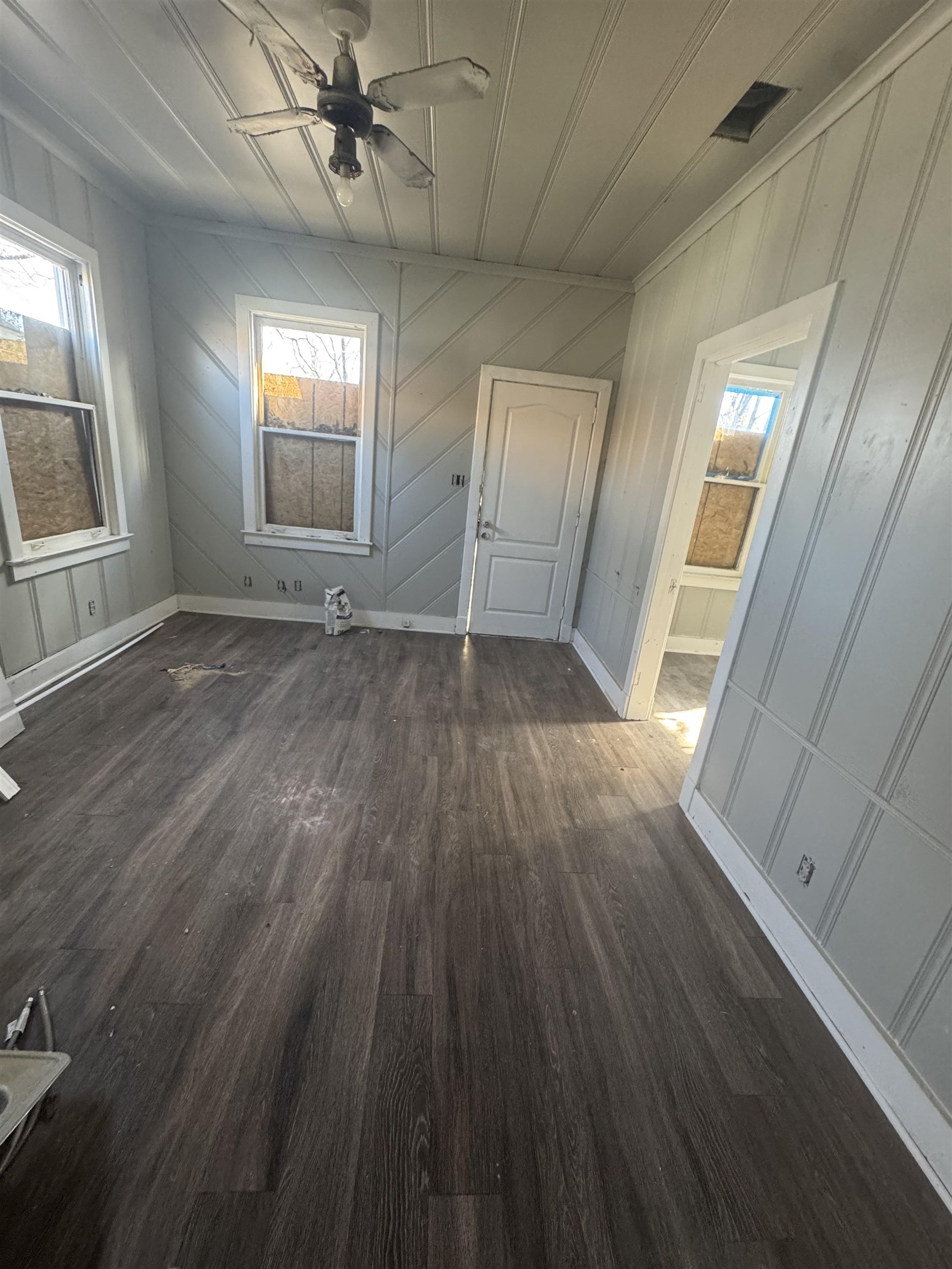 1134 Decatur Street Memphis, TN 38107 - Photo 3 of 12 a view of empty room with wooden floor and fan