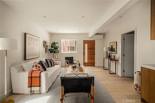 a living room with furniture and a table