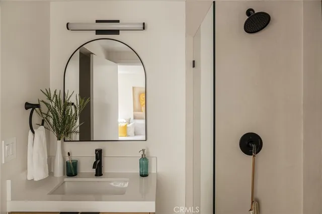 a bathroom with a sink and a mirror