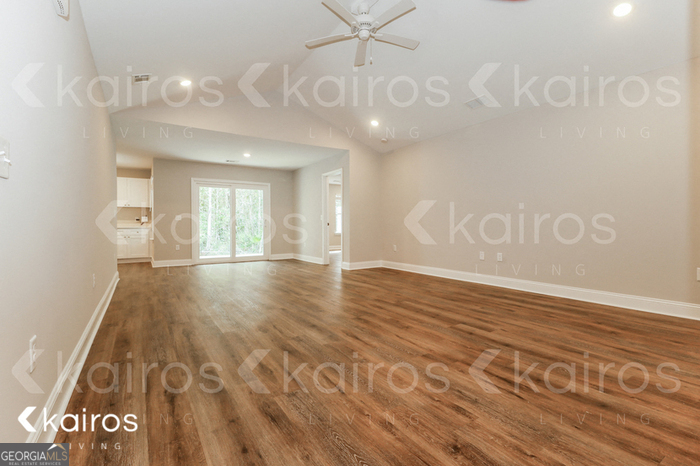 153 Cottage Grove Road Brunswick, GA 31525 - Photo 7 of 16 a view of an empty room and wooden floor