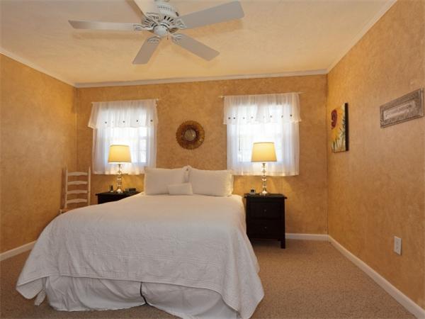 93 Allen Road Billerica, MA 01821 - Photo 14 of 25 a bedroom with a bed and a chandelier