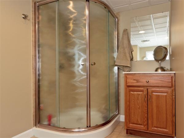 93 Allen Road Billerica, MA 01821 - Photo 17 of 25 a bathroom with a mirror and a shower