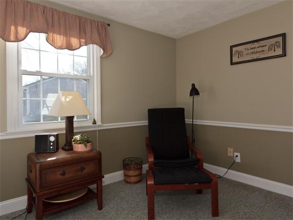 93 Allen Road Billerica, MA 01821 - Photo 20 of 25 a living room with furniture and a window