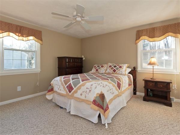 93 Allen Road Billerica, MA 01821 - Photo 21 of 25 a bed sitting in a bedroom next to a window