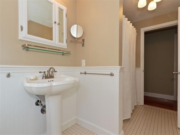 93 Allen Road Billerica, MA 01821 - Photo 22 of 25 a bathroom with a sink a mirror and a toilet